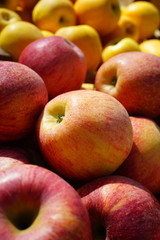Fresh red and yellow apples at a farmers market