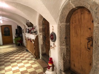 old farm stone hallway wooden doors