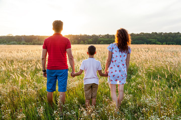 A rear view of the happy family spending time together