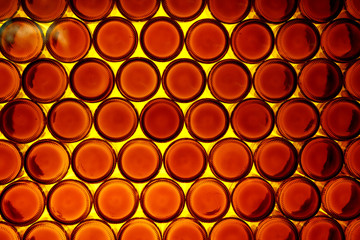 Background of bottoms of orange bottles
