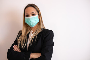 The young business woman in medical mask