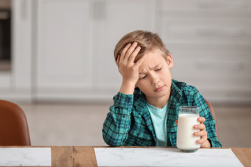 Little boy with dairy allergy in kitchen