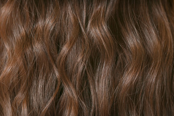 Healthy wavy female hair, closeup