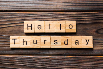 hello thursday word written on wood block. hello thursday text on wooden table for your desing, concept