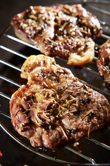 Meat with spice and herb on grill 