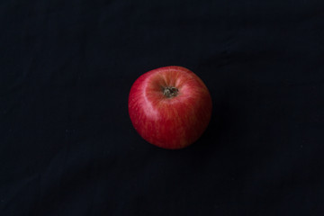 Top view red apple. Process is still life with bright colors. black background