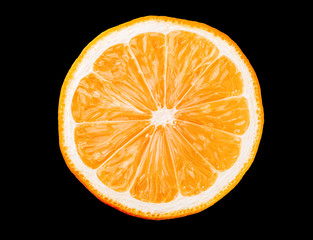 Macro photo of slice of orange fruit isolated on black background