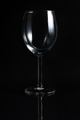 Empty glass for wine on a black background
