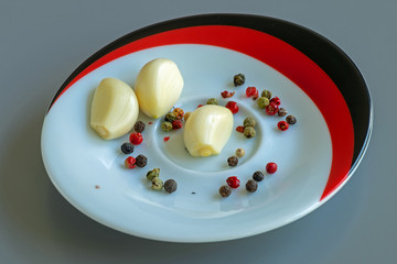 garlic and pepper on a small dish