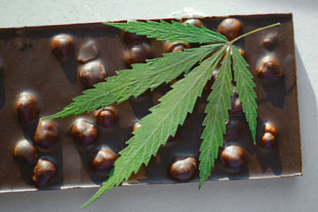 CBD Cannabis Chocolate with whole nuts Edibles, Marijuana leaf. Chocolate CBD and THC Infused...