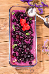 Fototapeta na wymiar homemade berry sorbet on a wooden background.