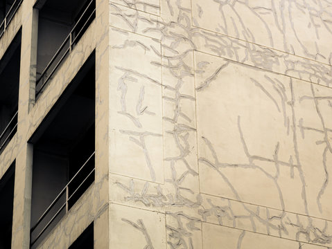 Old cement building with cracks.