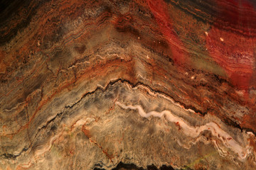 Folda Quartsite stone-Colorful texture with stripes, Polished metamorphic Stone Background, abstract stone surface with curved stripes. Foun in Norway mountains