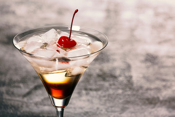 Alcoholic cocktail with ice in a glass. Party.