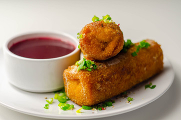 Delicious croquettes with sauerkraut and mushrooms served with hot red borscht