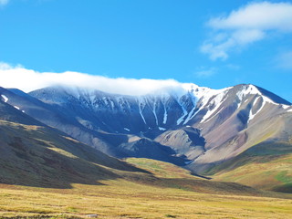 cloud caught on top of the mountain, Ukok Plateau, Altai Mountain