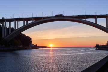 Arched bridge high above the strait