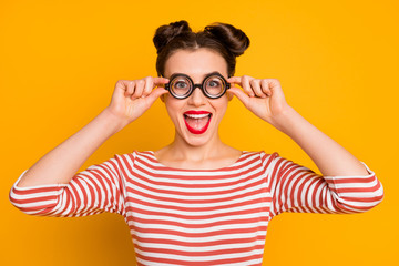 Closeup photo of pretty lady student look through circle freak specs open mouth excited good study mood wear striped red white shirt isolated bright yellow color background
