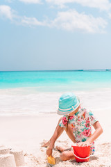 Portrait of adorable little girl at beach during summer vacation