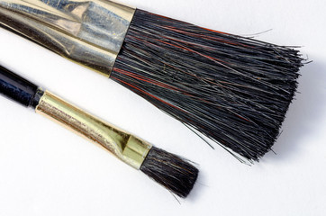 Fototapeta premium Two brushes with black hair