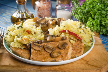 Braised pork loin with mushrooms.