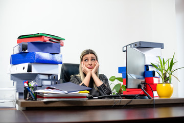 Woman sadly is sitting in her office