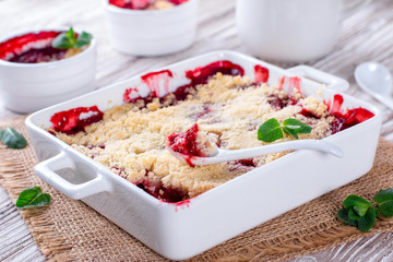 Berry crumble in white dish