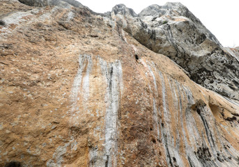 high rock of the mountain wall almost impassable
