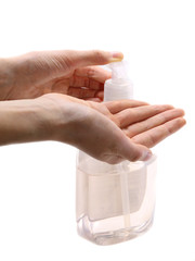 two hands of young girl while using antibacterial gel dispenser