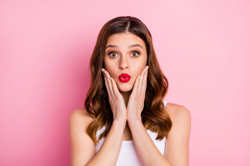 Portrait of crazy astonished redhead girl look incredible news touch her cheeks hands make lips...