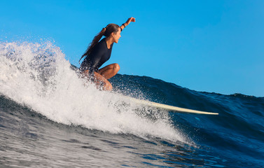 Female surfer on a wave - 331713679