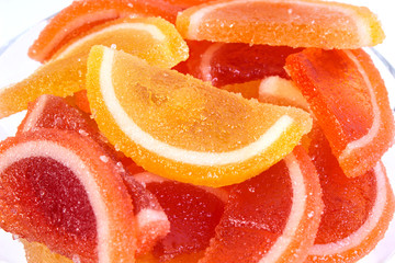 citrus marmalade in a candy bowl on a white background