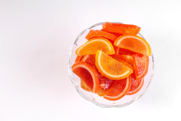citrus marmalade in a candy bowl on a white background