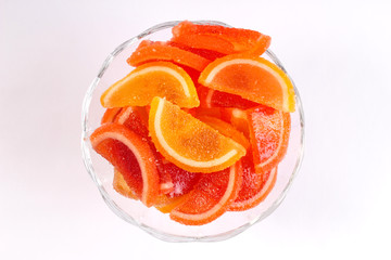 citrus marmalade in a candy bowl on a white background