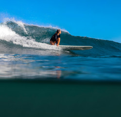 Female surfer on a wave