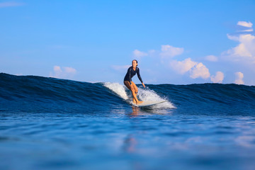 Female surfer on a wave