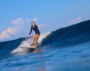 Female surfer on a wave - 331715825