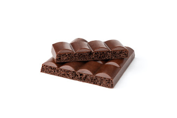 Porous dark chocolate isolated on white background.