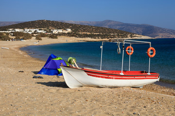 Naxos / Greece - August 23, 2014: A fisherman boat at Agiassos beach, Naxos, Cyclades Islands, Greece - obrazy, fototapety, plakaty
