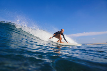 Female surfer on a wave