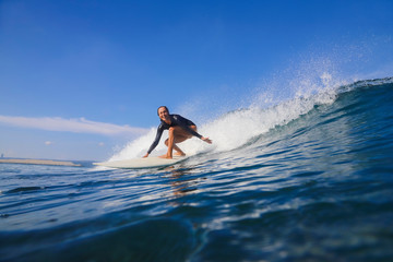 Female surfer on a wave