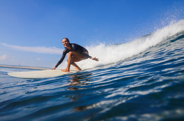 Female surfer on a wave