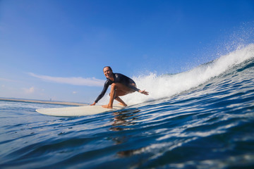 Female surfer on a wave - 331717463