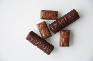 chocolate candies on a white background.