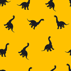 Black dinosaurs on yellow background. Seamless pattern