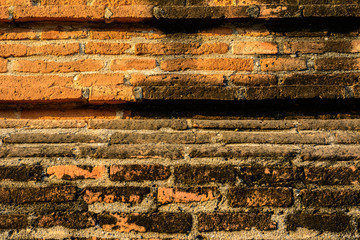 Old vintage brick wall in Lopburi, Thailand. Weathered brick wall texture background at old temple.