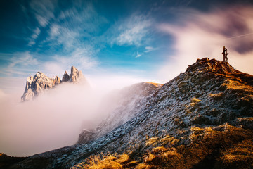 View from Seceda, Odle mountains in the fog, over the clouds. Amazing unique views in Dolomites mountains, Italy, Europe. - 331719653