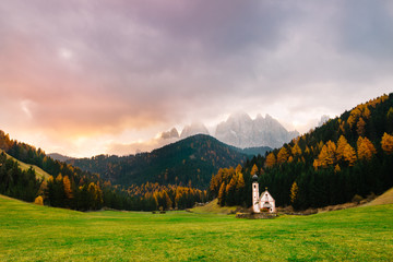 Val di Funes, Dolomites, Santa Maddalena with famous San Giovanni church and peaks of the alps, South Tirol, Italy. Popular tourist attraction. Beautiful Europe.