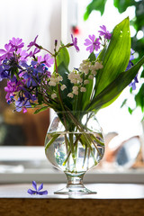 Spring bouquet of flowers in a vase on the table