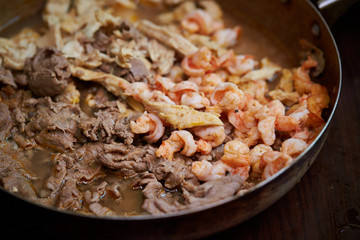 Cooking chicken, beef and shrimp 